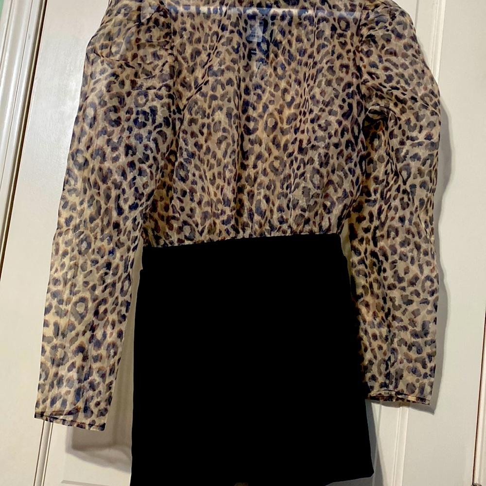Cheetah print romper black is slightly open.